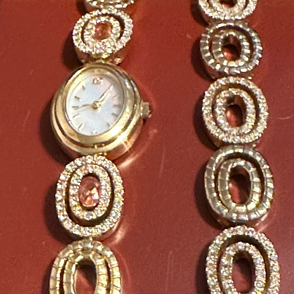 Matching watch & bracelet with case. Slightly used